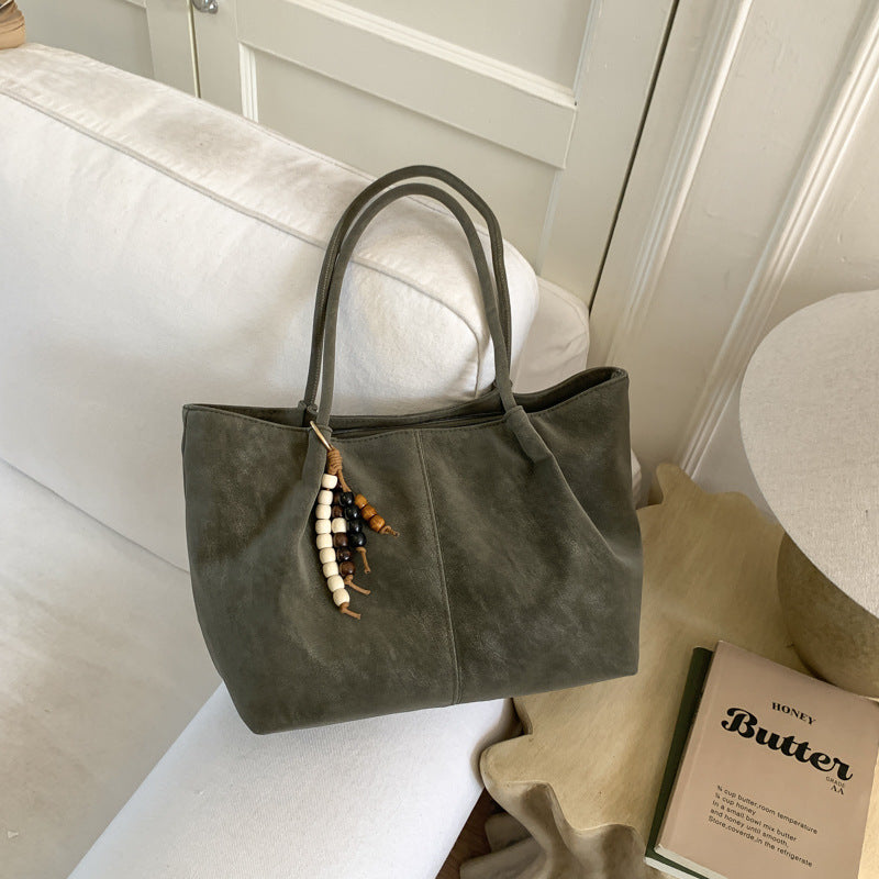 Women's Shoulder Bag in brown with pendant - product photo 1